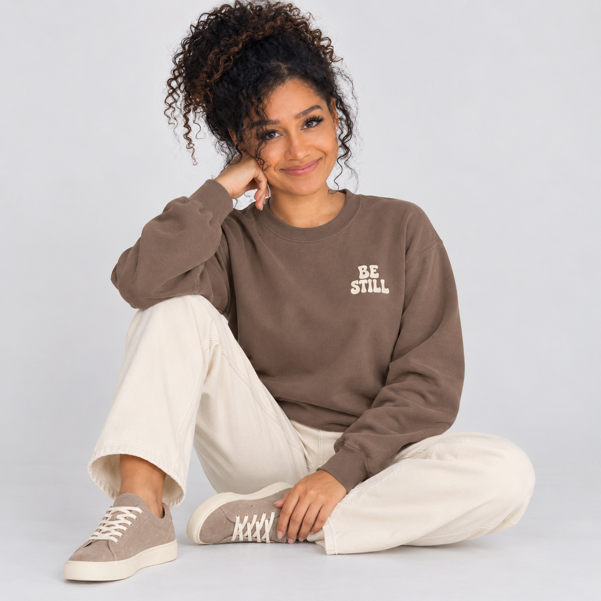 Be Still & Know Sweatshirt in Espresso — relaxed lifestyle pose.