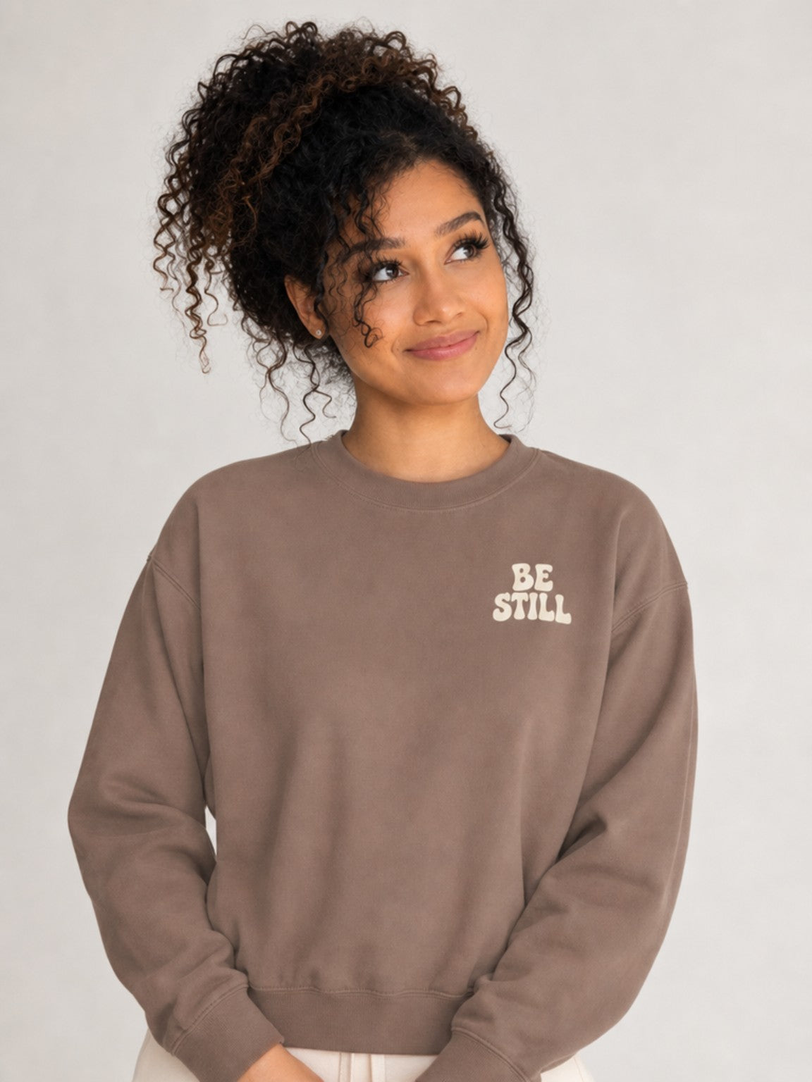 Be Still & Know Sweatshirt in Espresso — looking up pose.