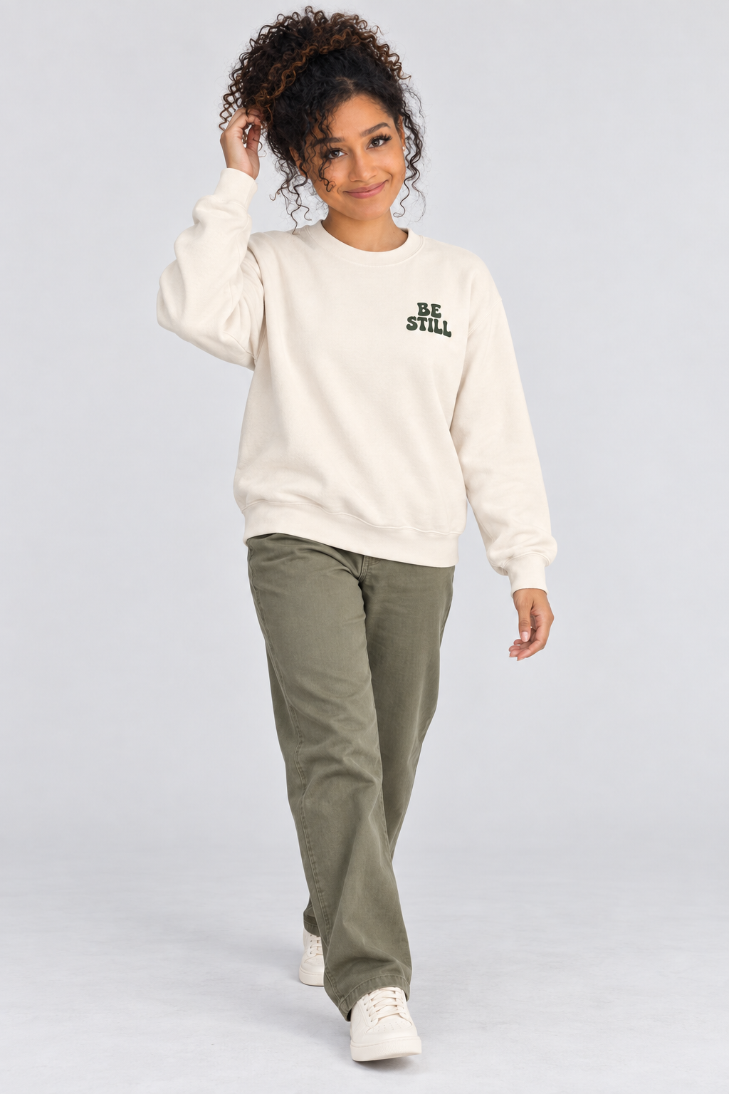 Be Still & Know Sweatshirt in Ivory — relaxed lifestyle pose.
