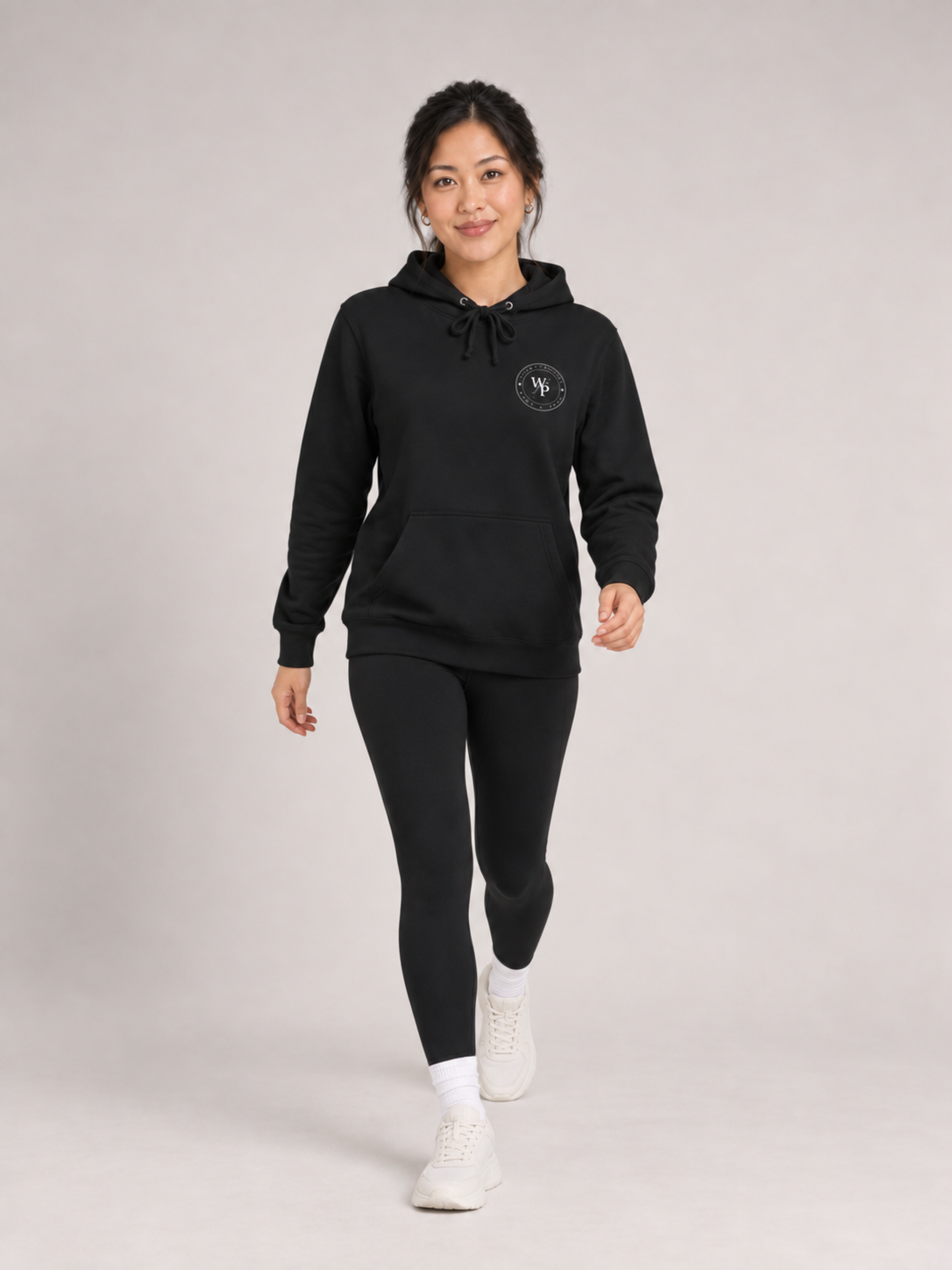 Covered in Purpose Hoodie in Black, walking view
