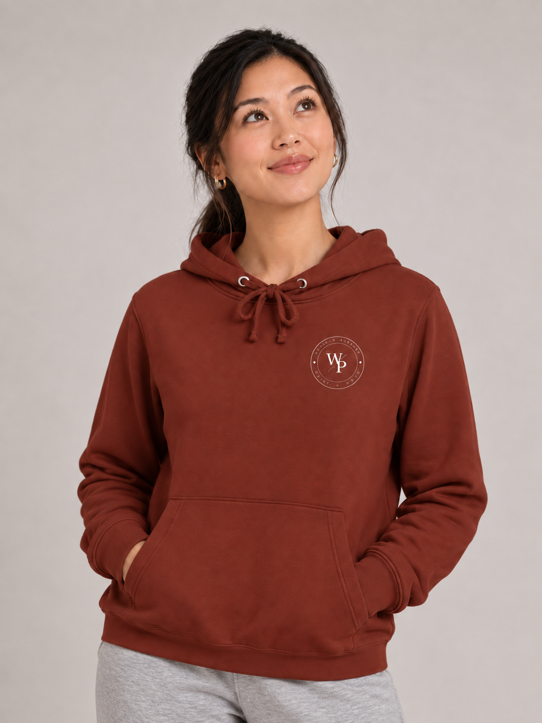 Covered in Purpose Hoodie in Paprika, looking up view