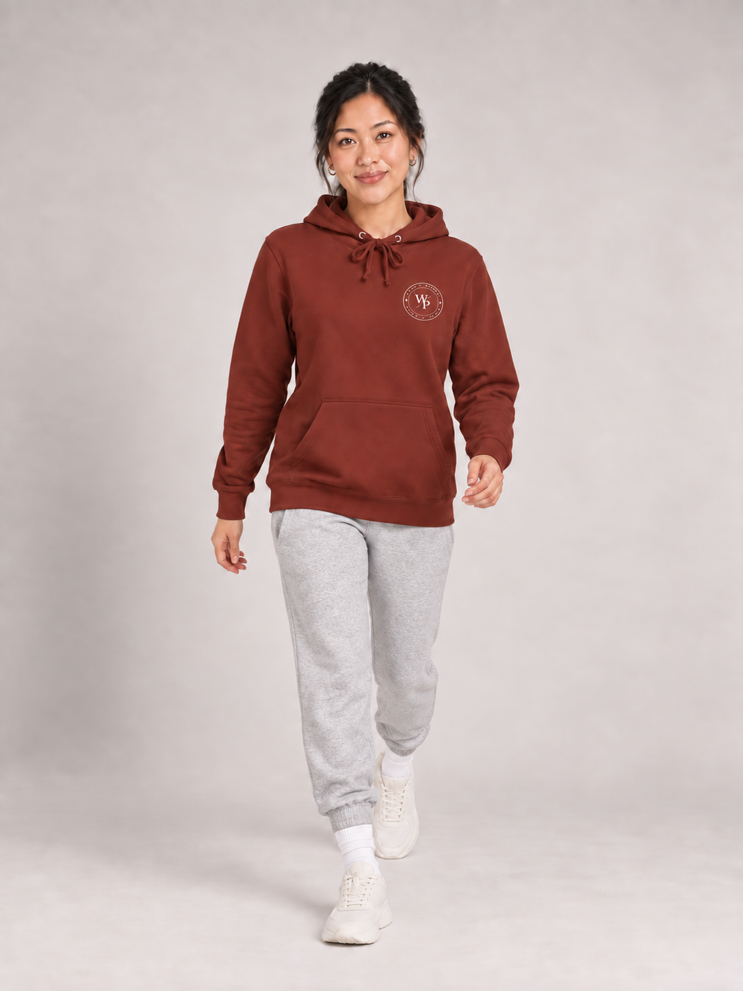 Covered in Purpose Hoodie in Paprika, walking view