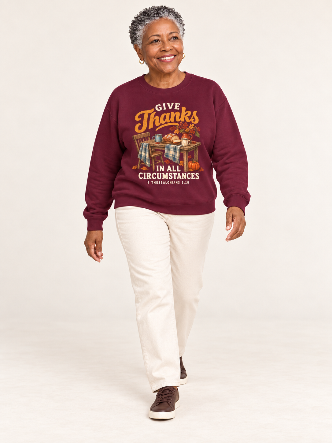 Give Thanks sweatshirt in Maroon — walking on a model