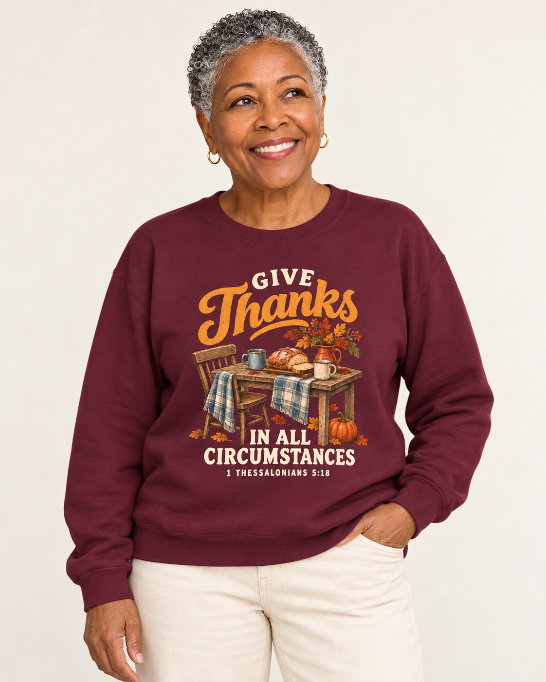Give Thanks sweatshirt in Maroon — front design close-up on a model