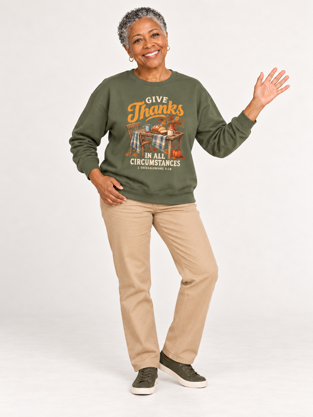 Give Thanks sweatshirt in Military Green — playful standing on a model