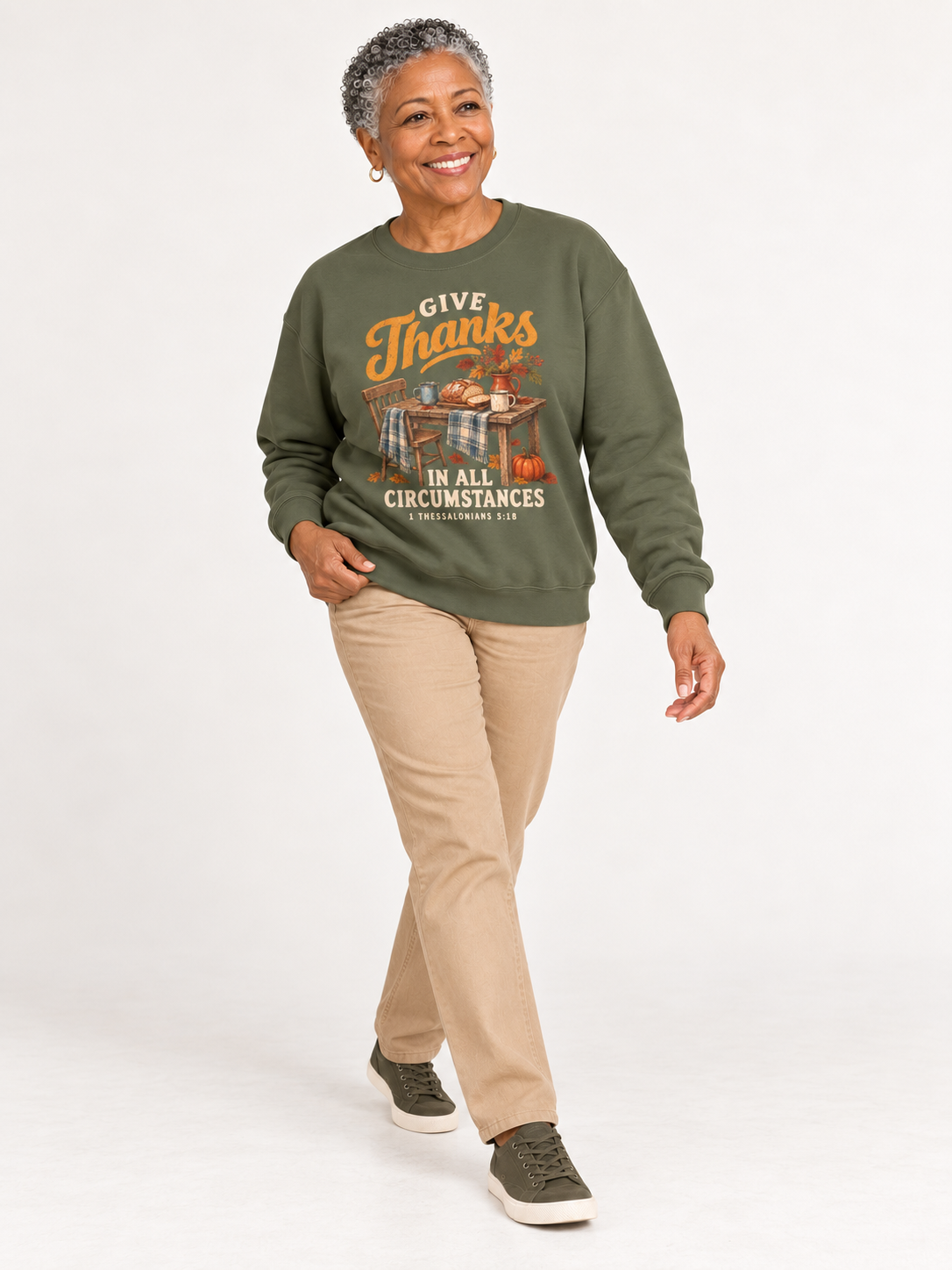 Give Thanks sweatshirt in Military Green — walking on a model