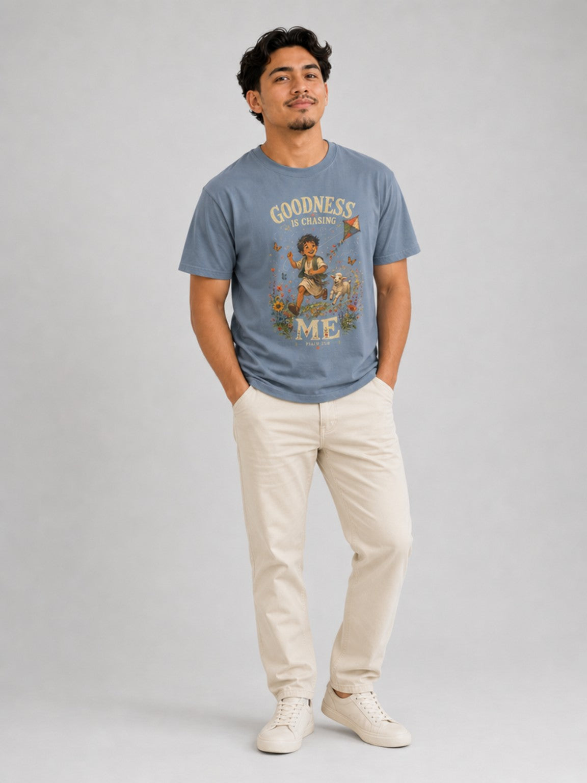 Goodness Is Chasing Me Psalm 23:6 tee in Blue Jean, standing model view