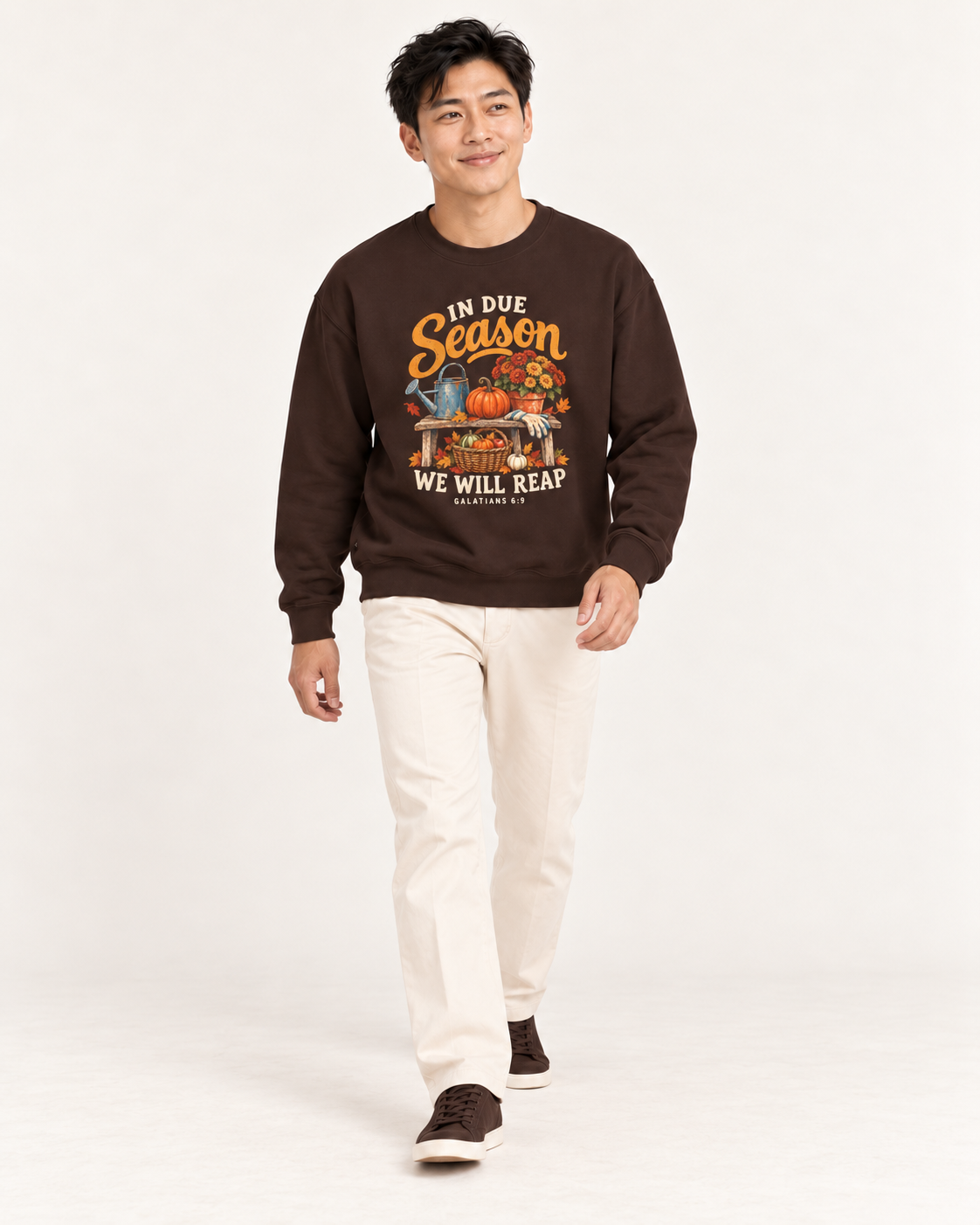 In Due Season sweatshirt in Dark Chocolate — walking on a model