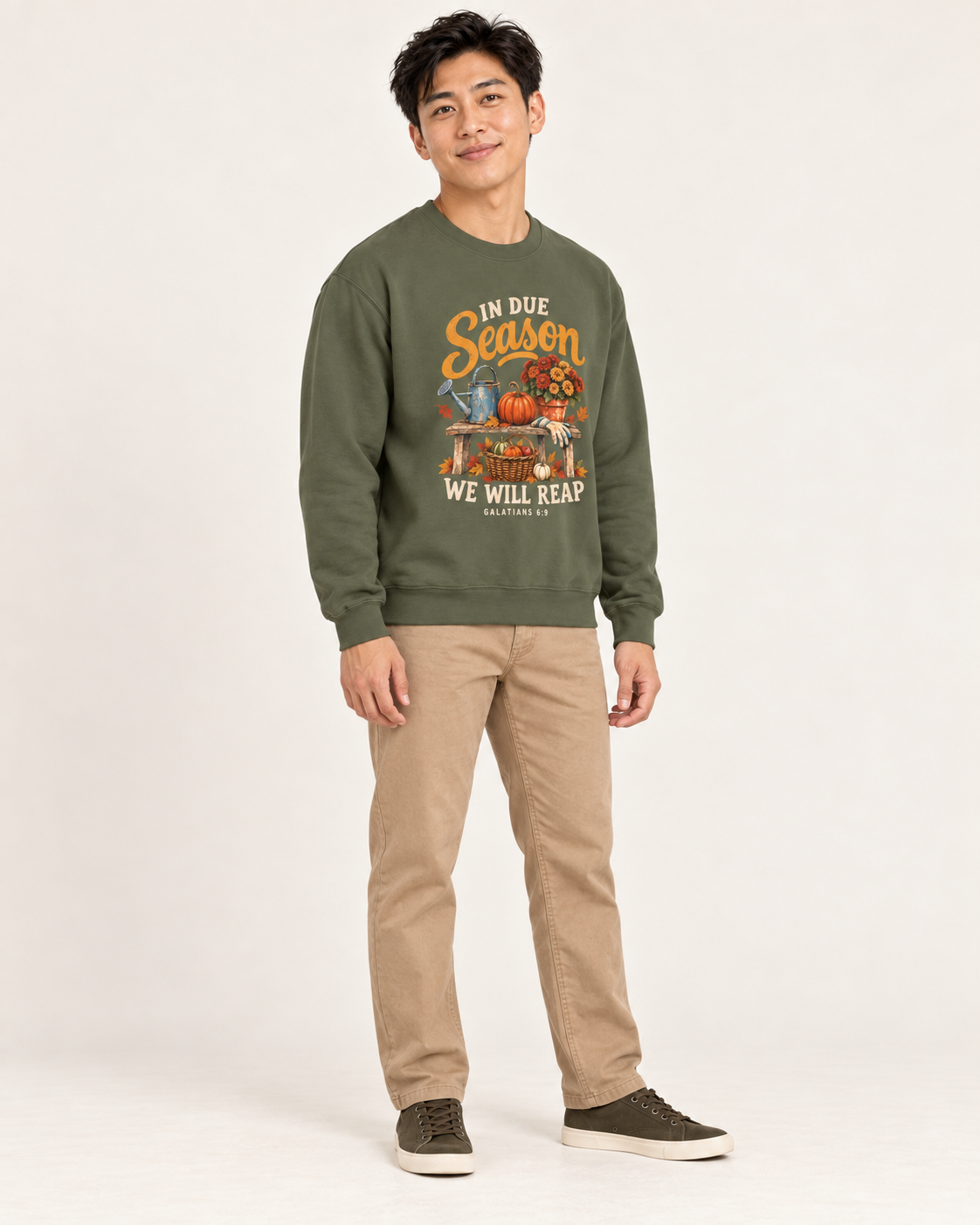 In Due Season sweatshirt in Military Green — standing on a model