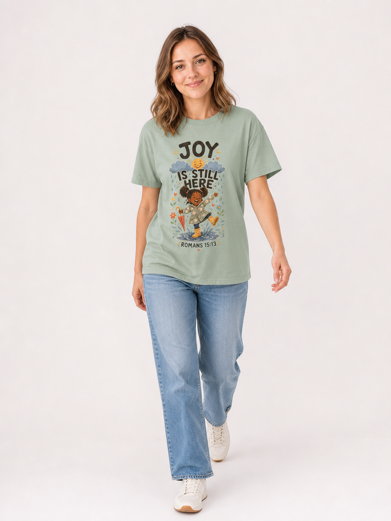 Joy Is Still Here Romans 15:13 Christian tee in Bay, full-body view