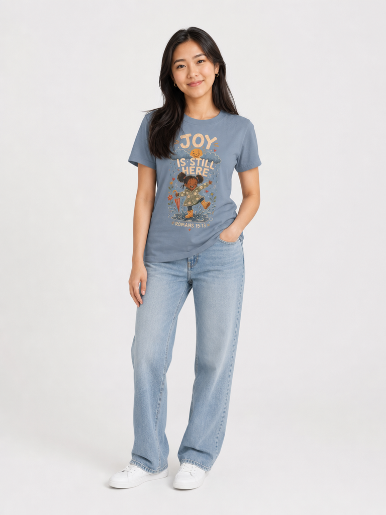 Joy Is Still Here Romans 15:13 Christian tee in Blue Jean, full-body view