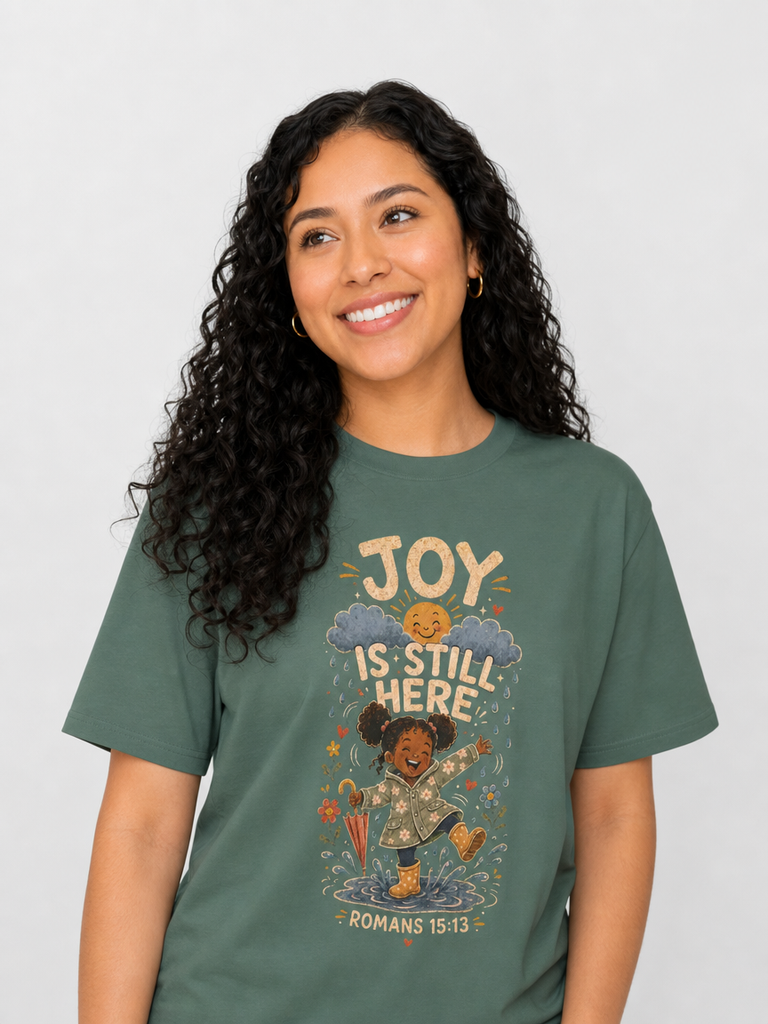 Joy Is Still Here Romans 15:13 Christian tee in Blue Spruce, featured close-up