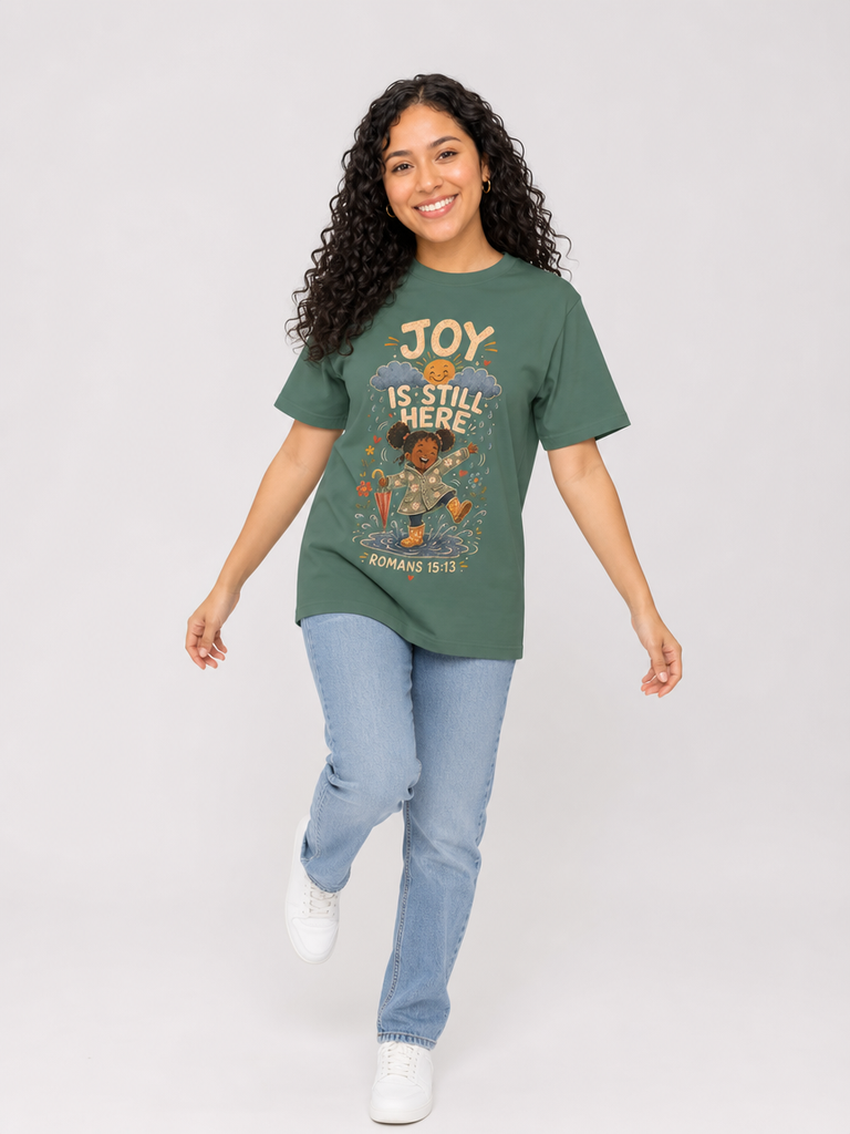 Joy Is Still Here Romans 15:13 Christian tee in Blue Spruce, full-body view