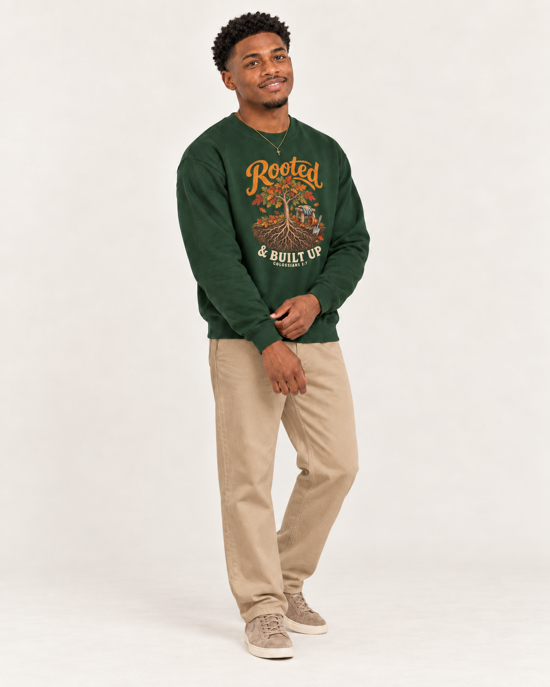 Rooted & Built Up sweatshirt in Forest Green — standing on a model