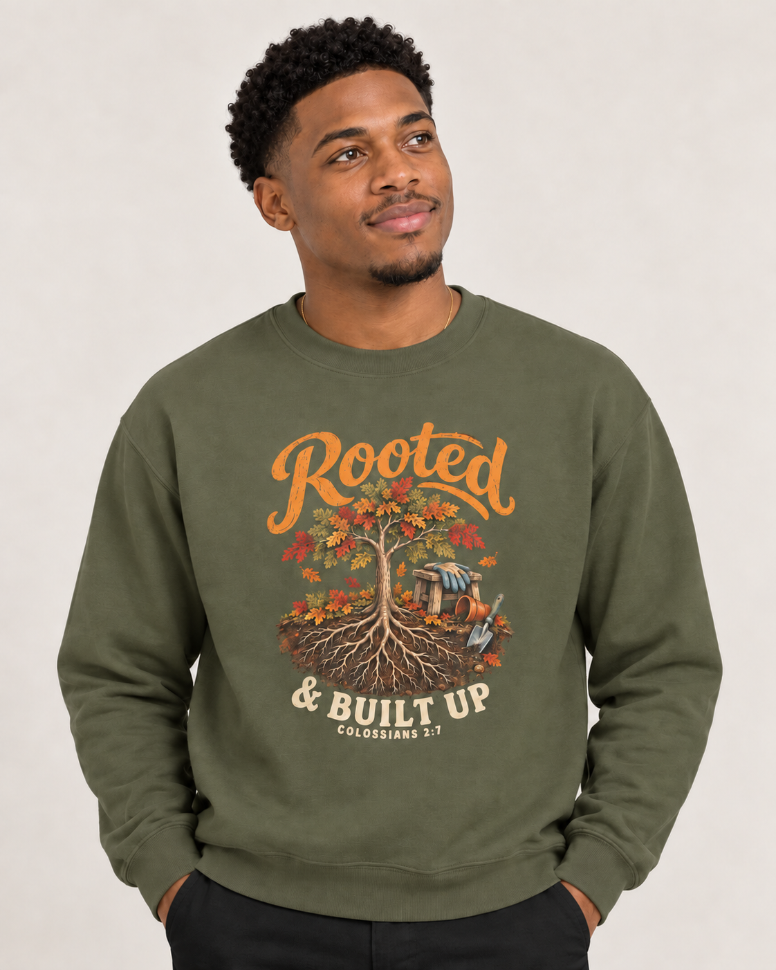 Rooted & Built Up sweatshirt in Military Green — front design close-up on a model