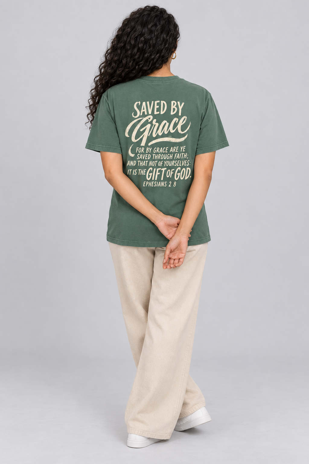 Woman wearing the Blue Spruce Saved By Grace Tee in a full back pose.