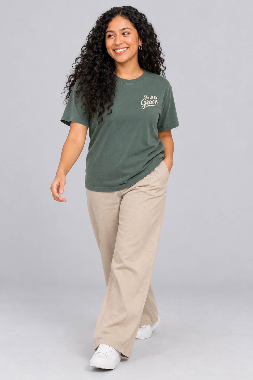 Woman wearing the Blue Spruce Saved By Grace Tee in a walking pose.