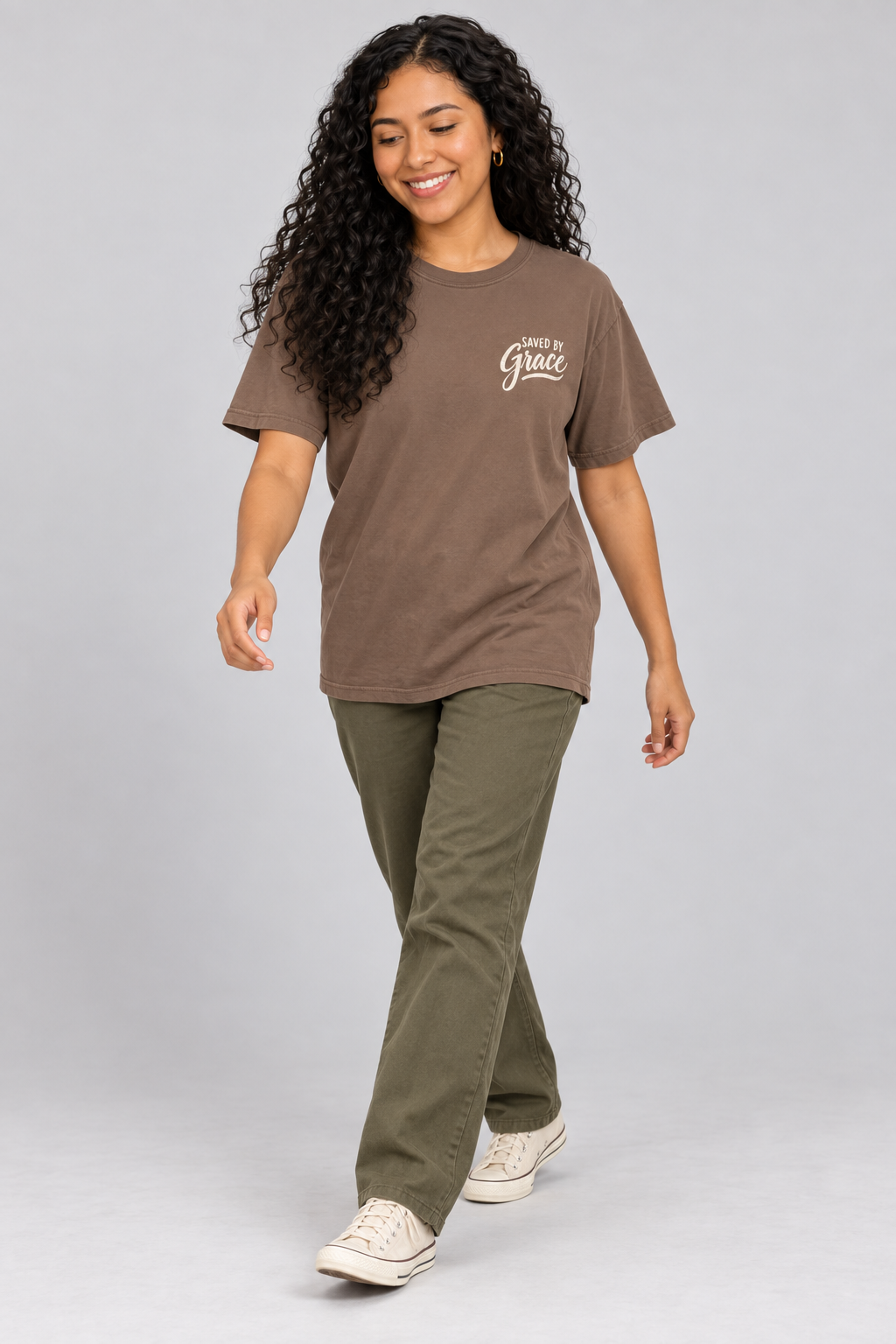 Woman wearing the Espresso Saved By Grace Tee in a walking pose.