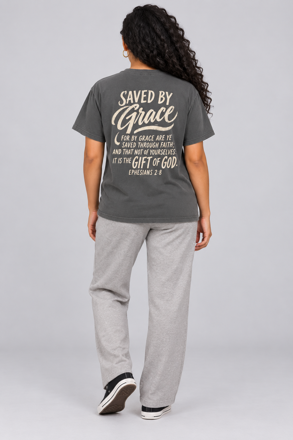 Woman wearing the Pepper Saved By Grace Tee in a full back pose.