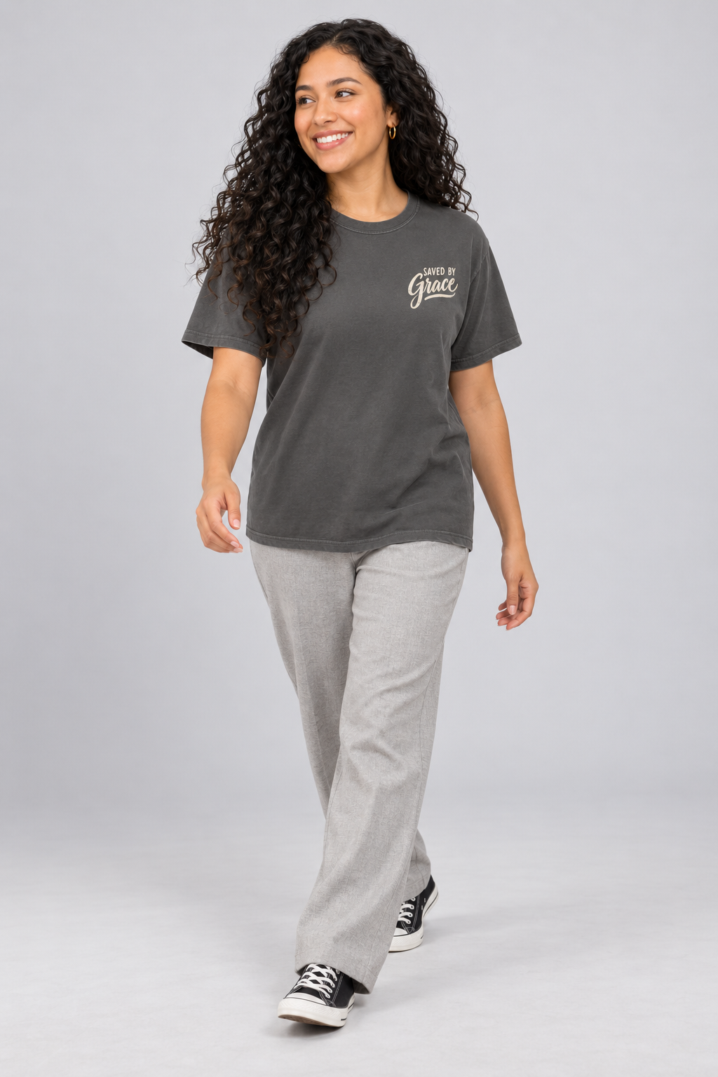 Woman wearing the Pepper Saved By Grace Tee in a walking pose.