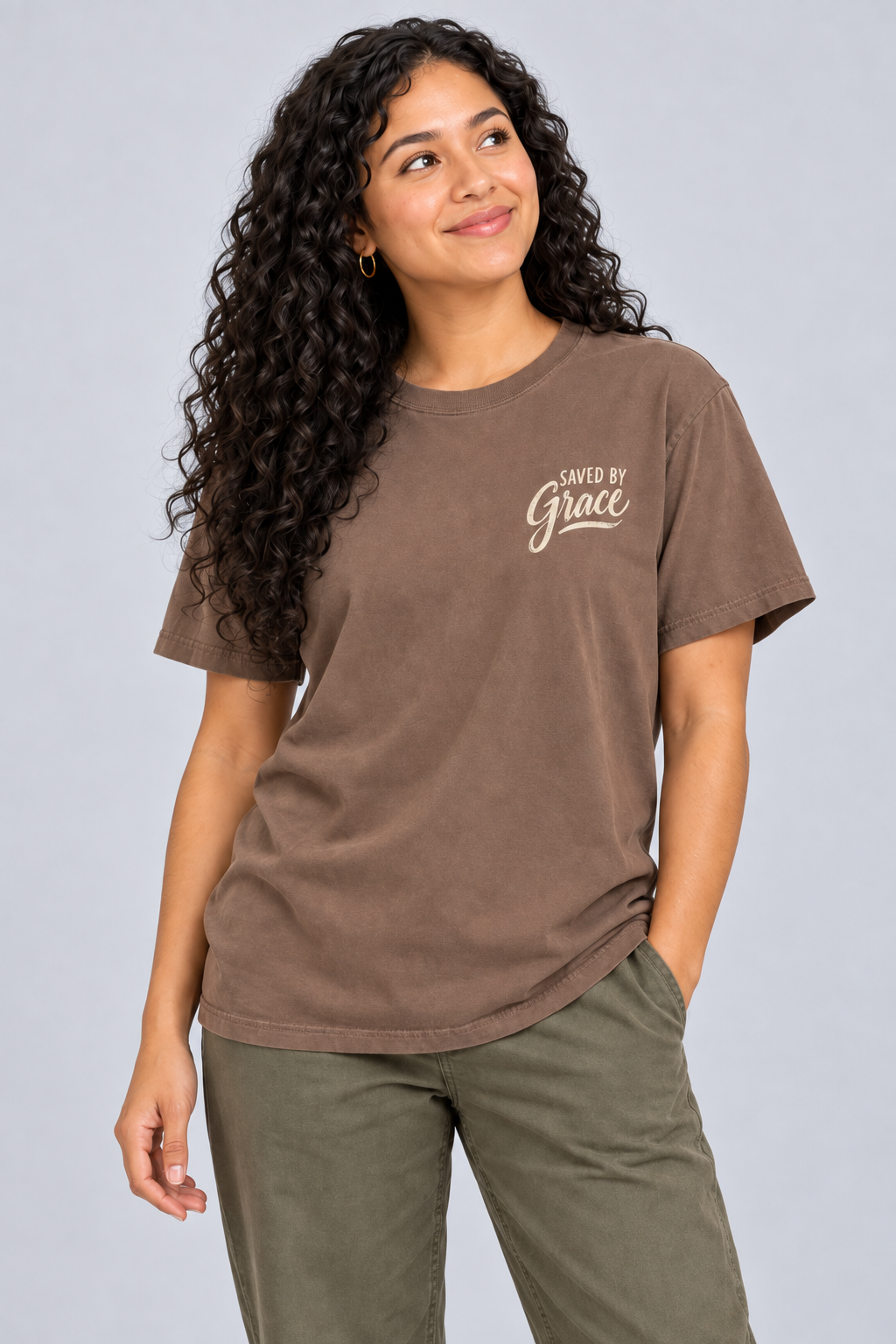 Woman wearing the Espresso Saved by Grace Tee in a close looking-up pose.
