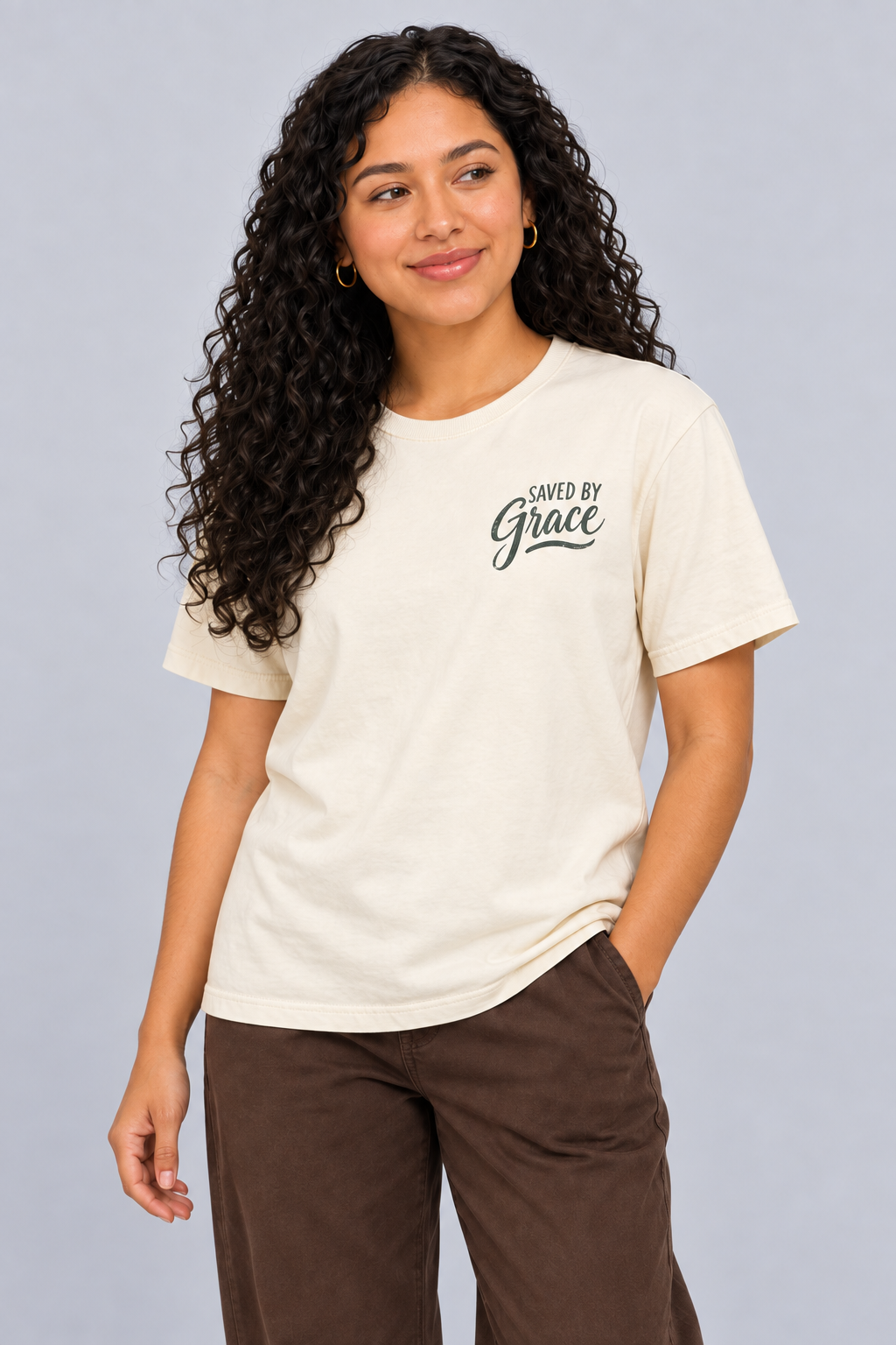 Woman wearing the Ivory Saved by Grace Tee in a close looking-up pose.