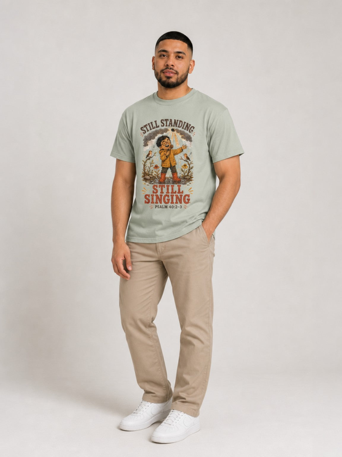 Still Standing, Still Singing Psalm 40:2-3 Comfort Colors tee in Bay, standing view