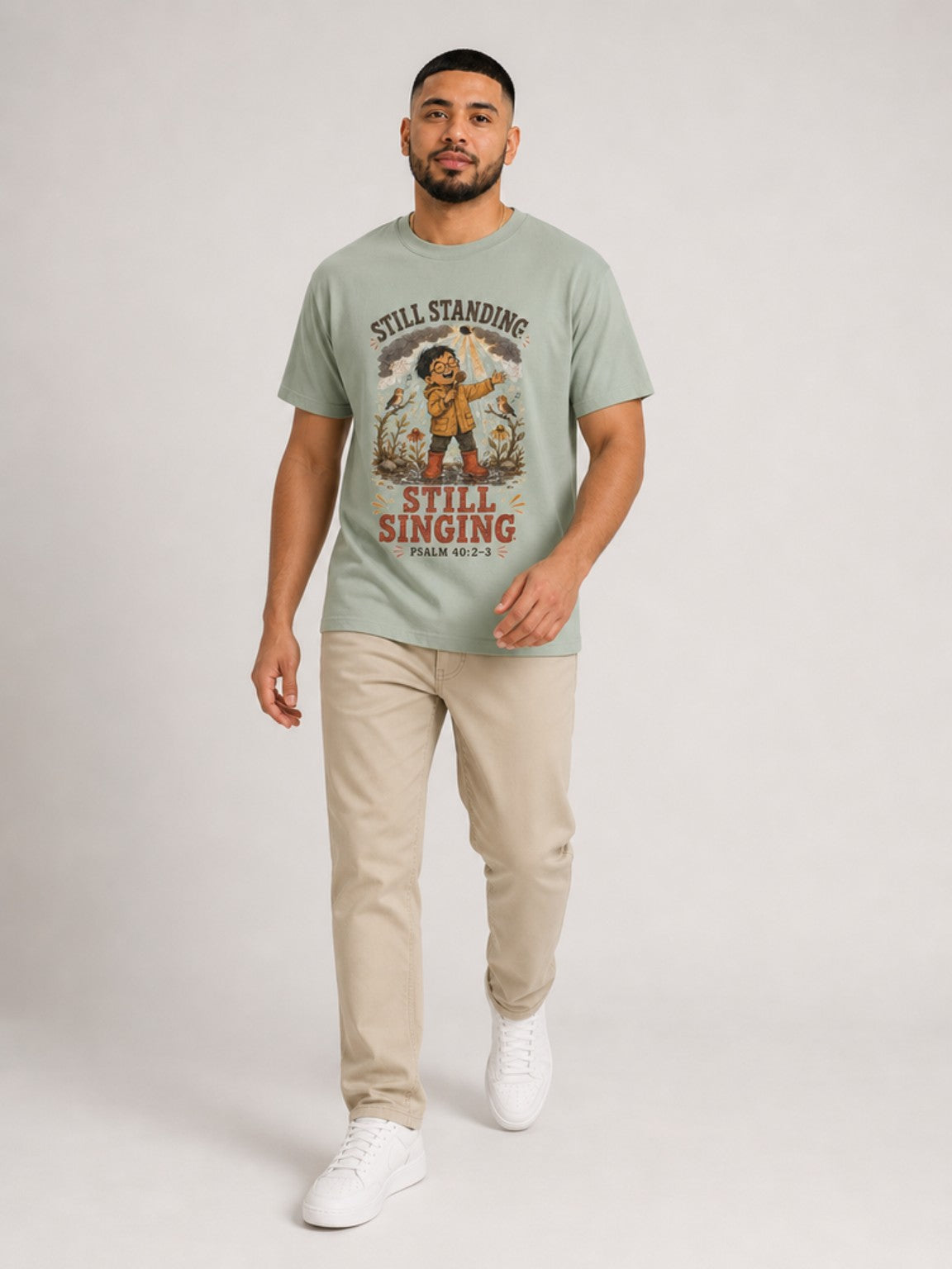 Still Standing, Still Singing Psalm 40:2-3 Comfort Colors tee in Bay, walking view