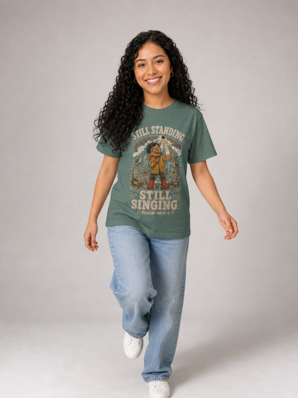 Still Standing, Still Singing Psalm 40:2-3 Comfort Colors tee in Blue Spruce, walking view