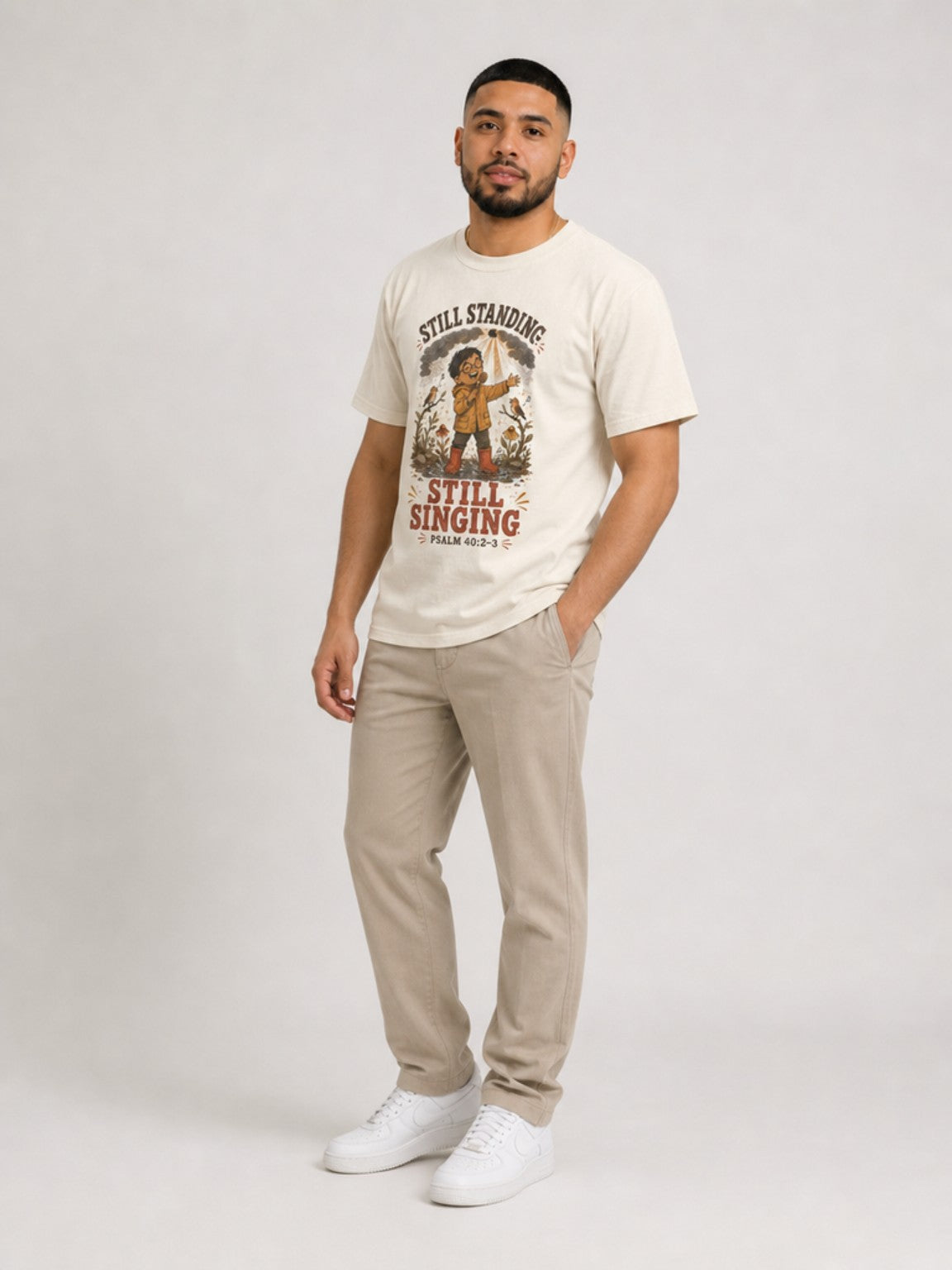 Still Standing, Still Singing Psalm 40:2-3 Comfort Colors tee in Ivory, standing view