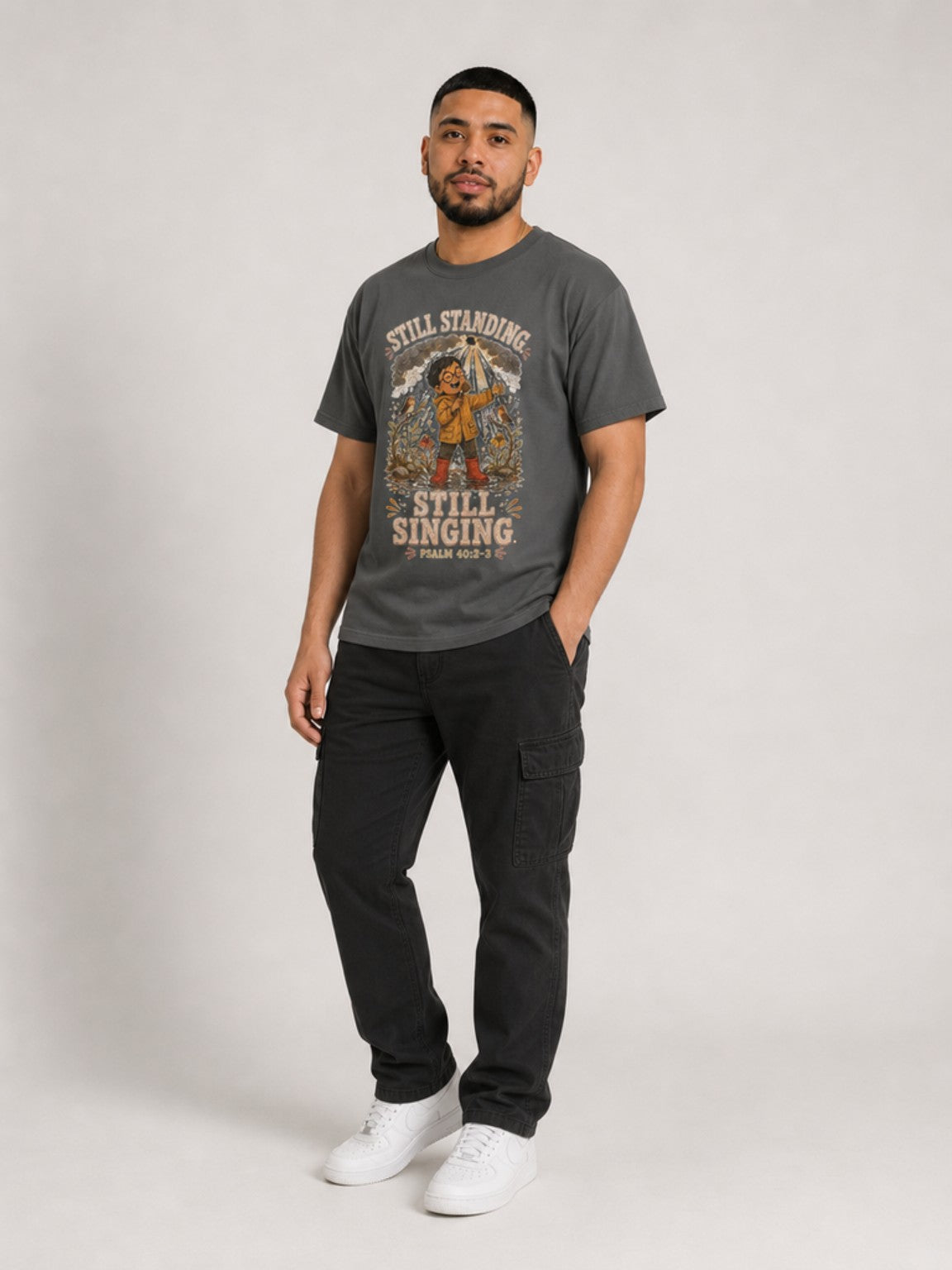 Still Standing, Still Singing Psalm 40:2-3 Comfort Colors tee in Pepper, standing view