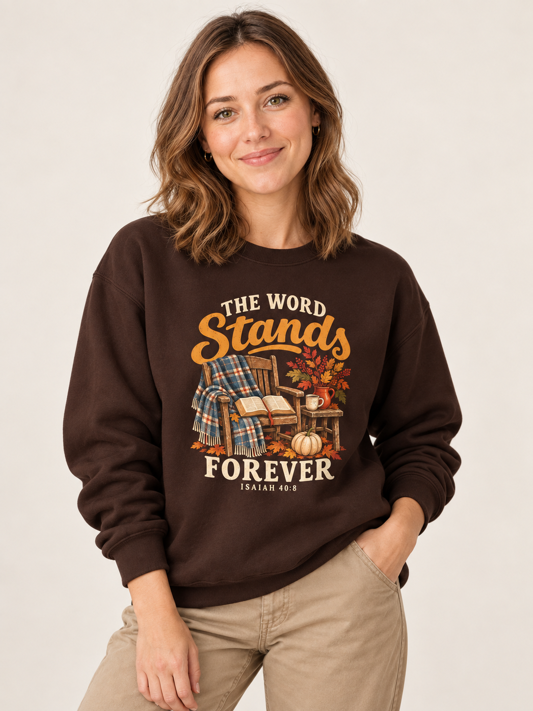 The Word Stands Forever sweatshirt in Dark Chocolate — front design close-up on a model