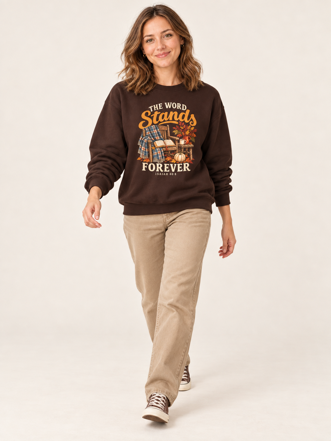 The Word Stands Forever sweatshirt in Dark Chocolate — walking on a model