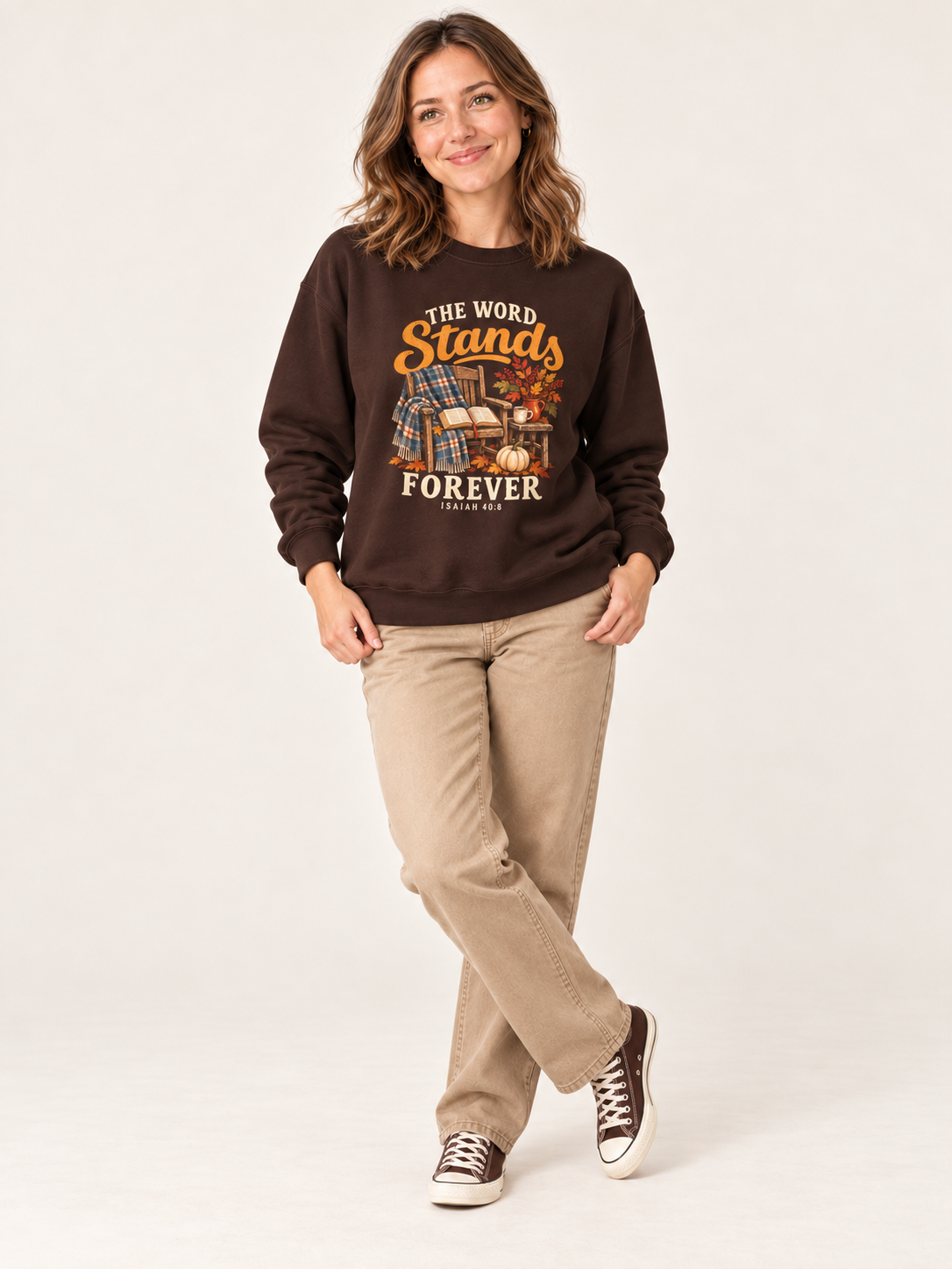 The Word Stands Forever sweatshirt in Dark Chocolate — standing on a model