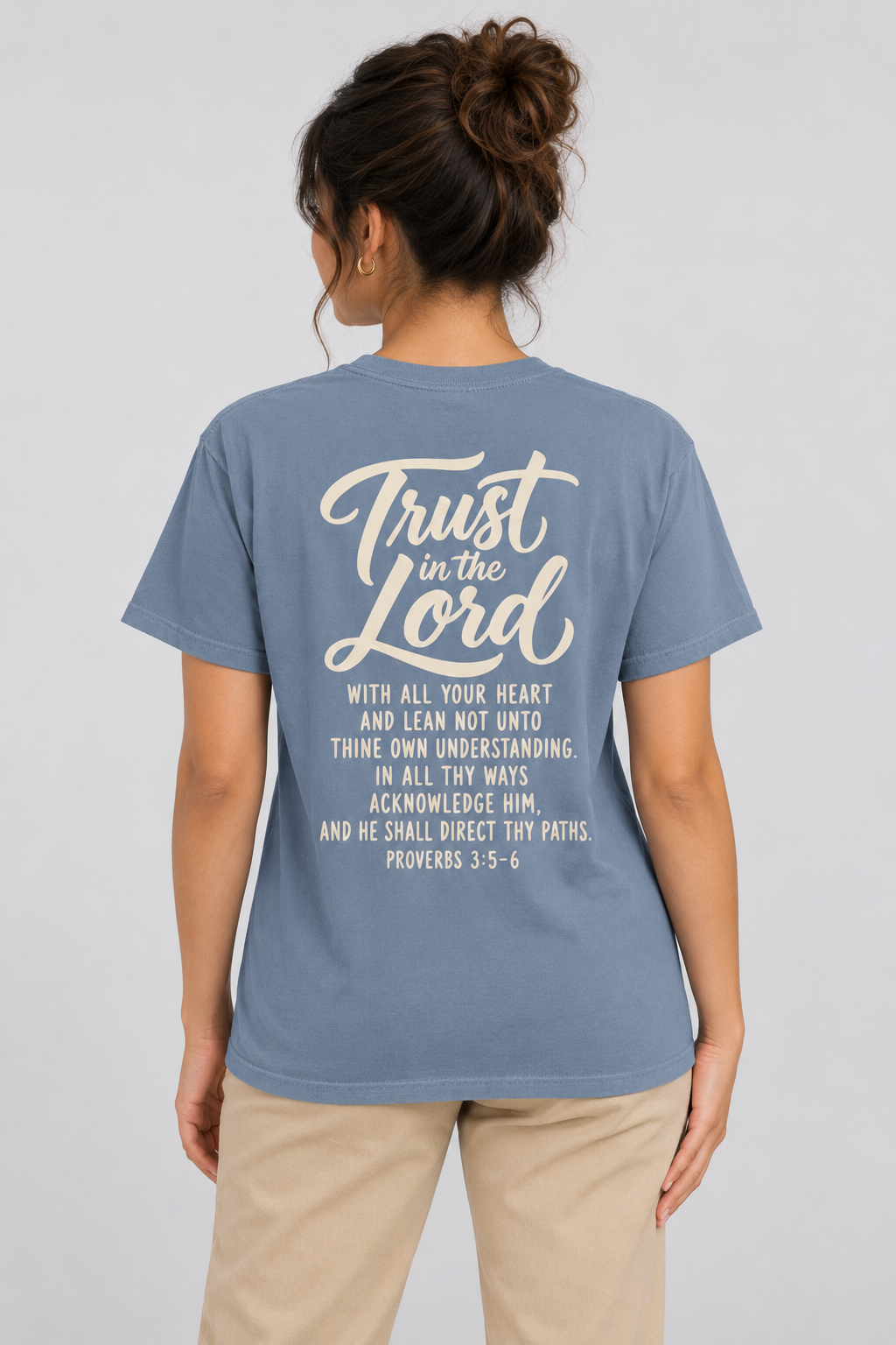 Woman wearing the Blue Jean Trust In The Lord Tee in a full back pose.