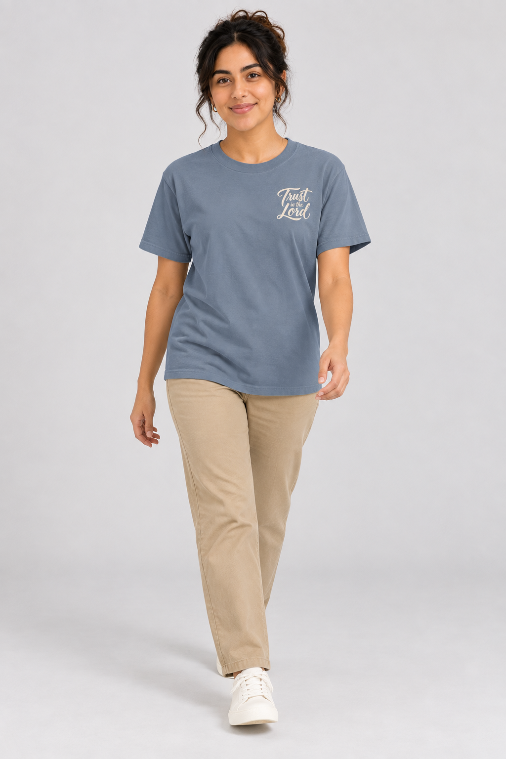 Woman wearing the Blue Jean Trust In The Lord Tee in a walking pose.