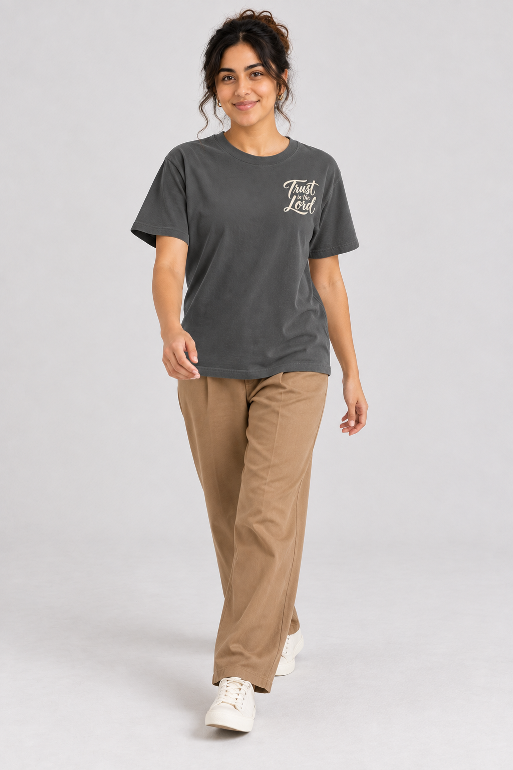 Woman wearing the Pepper Trust In The Lord Tee in a walking pose.