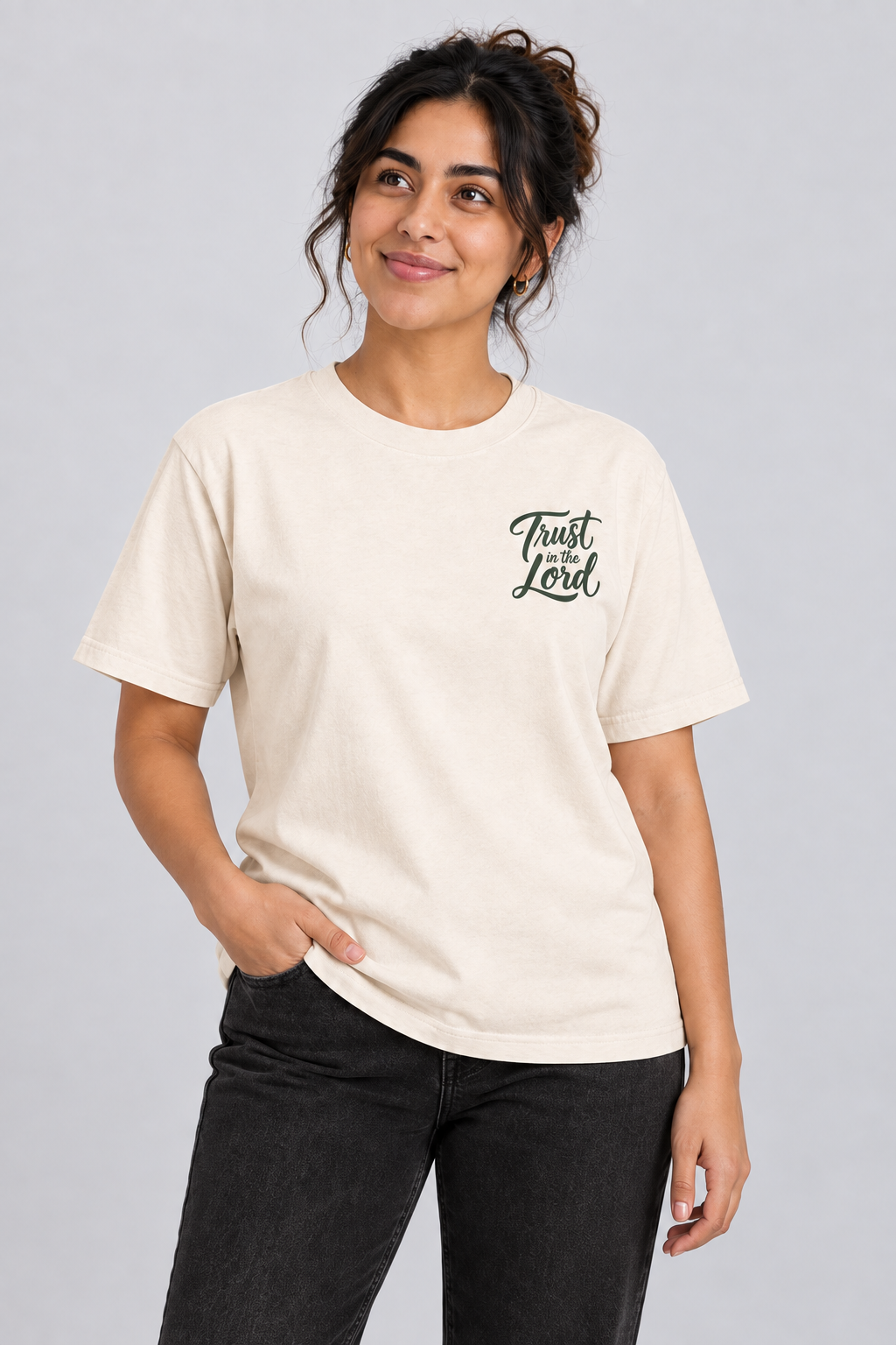 Woman wearing the Ivory Trust in the Lord Tee in a close looking-up pose.