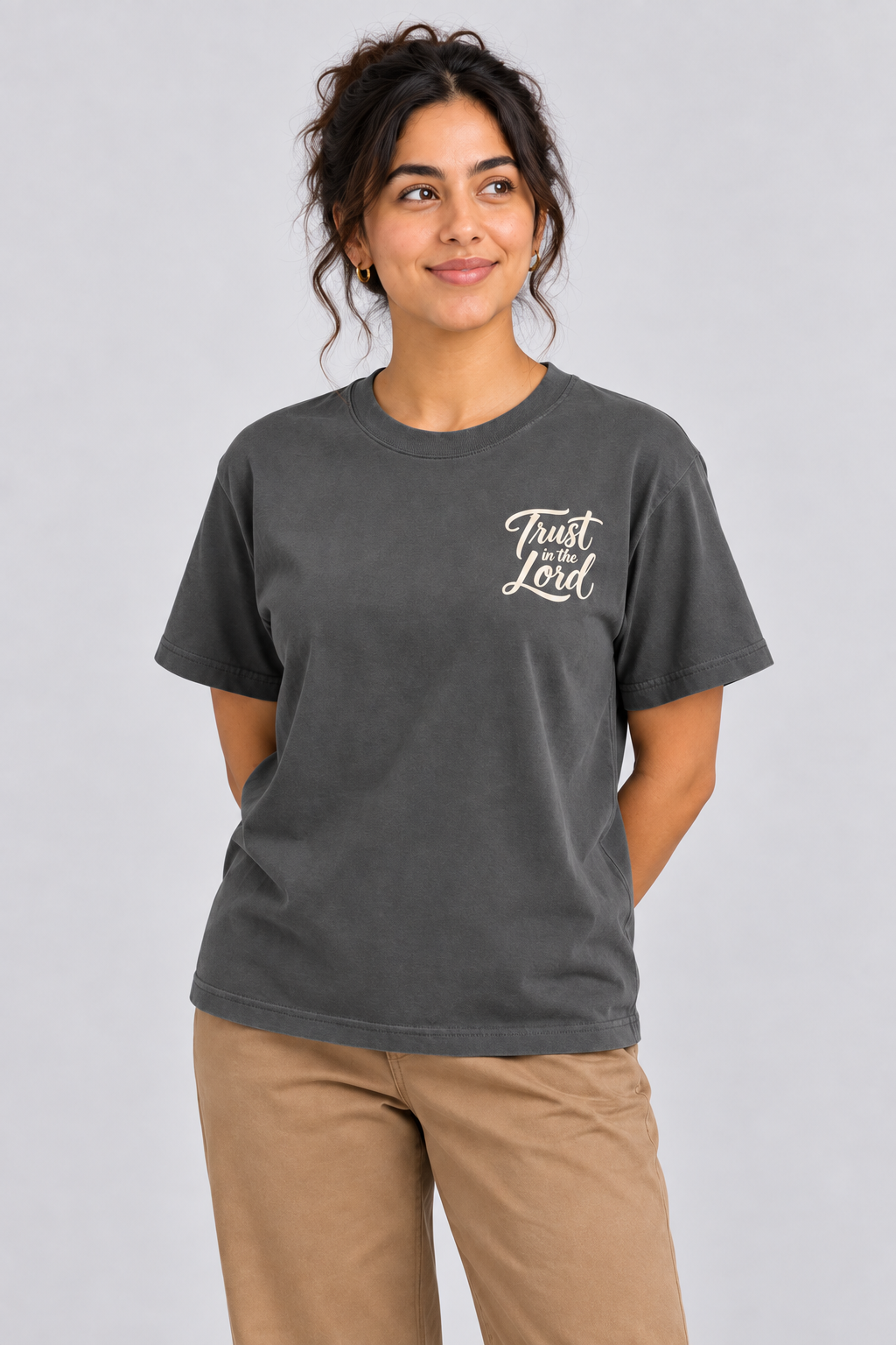 Woman wearing the Pepper Trust in the Lord Tee in a close looking-up pose.