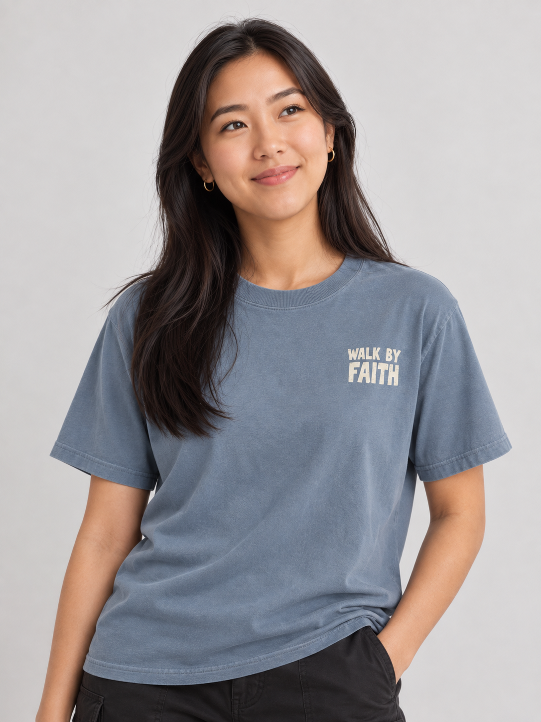 Woman wearing the Blue Jean Walk By Faith Tee in a looking up pose.