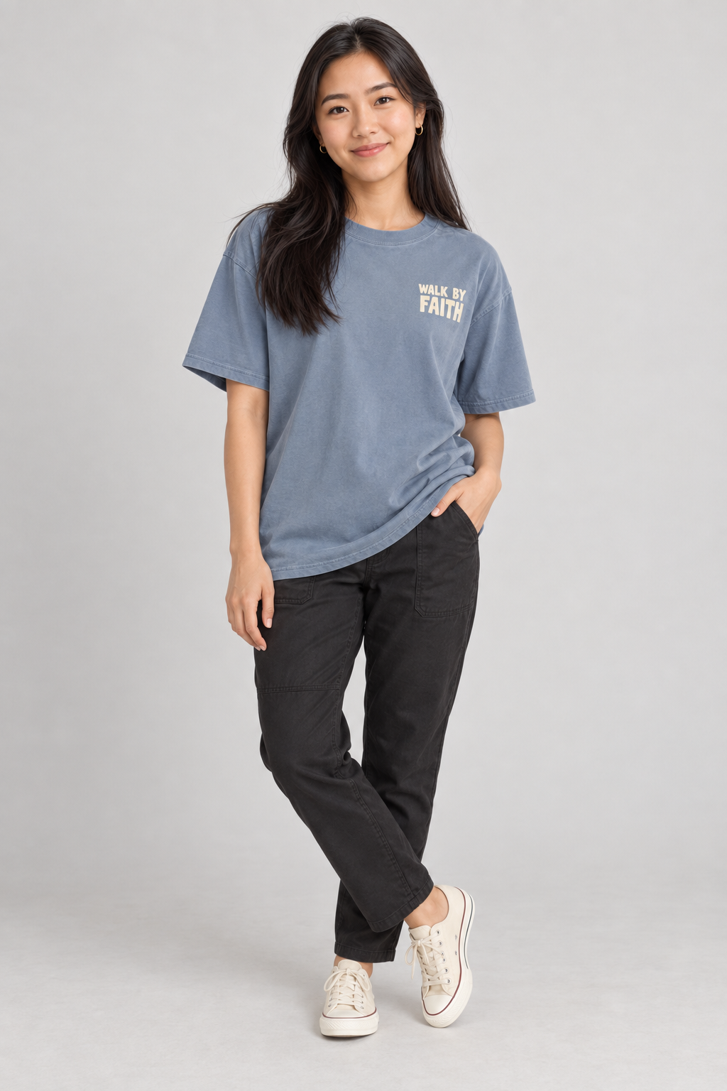 Woman wearing the Blue Jean Walk By Faith Tee in a standing pose.