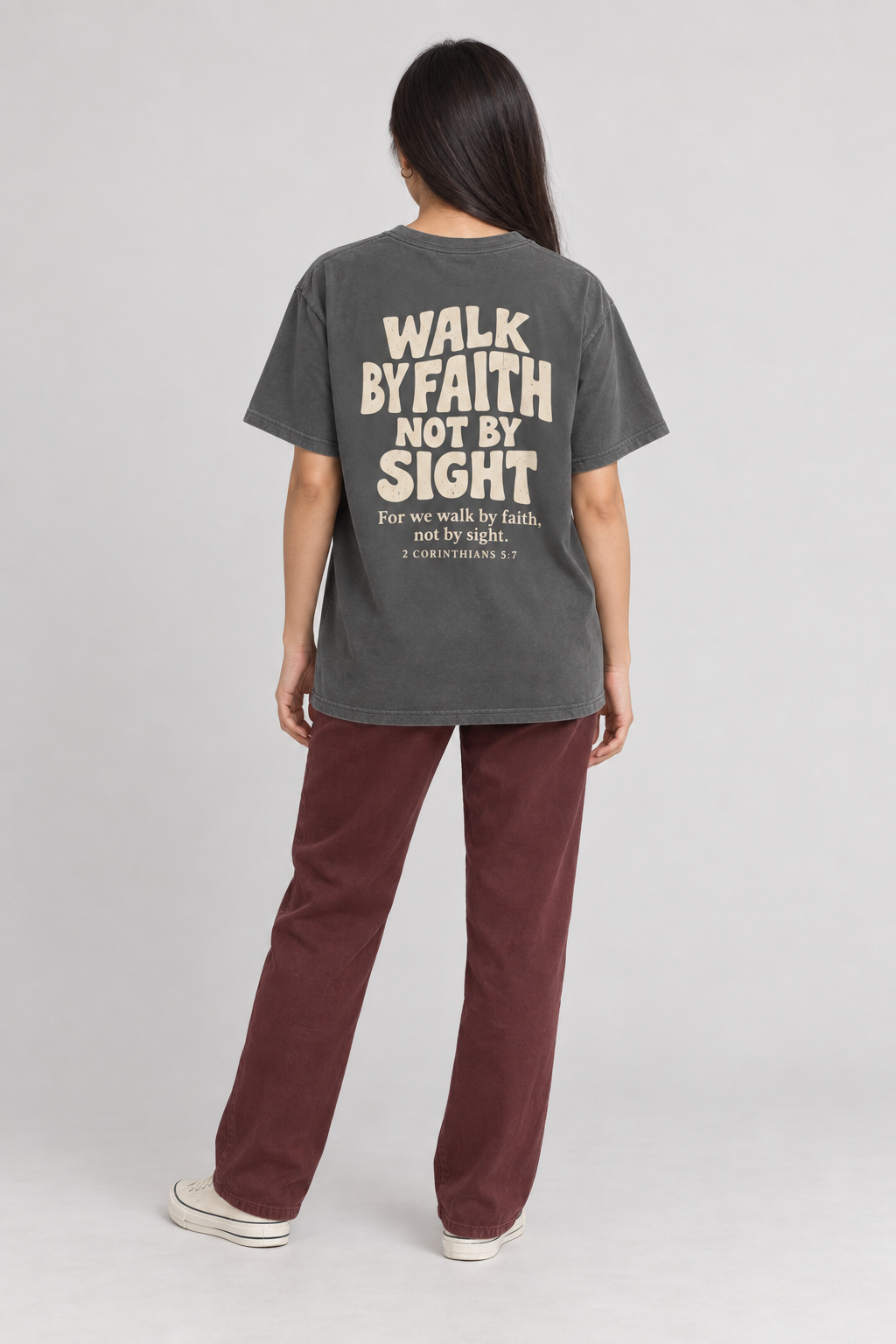 Woman wearing the Pepper Walk By Faith Tee in a full back pose.