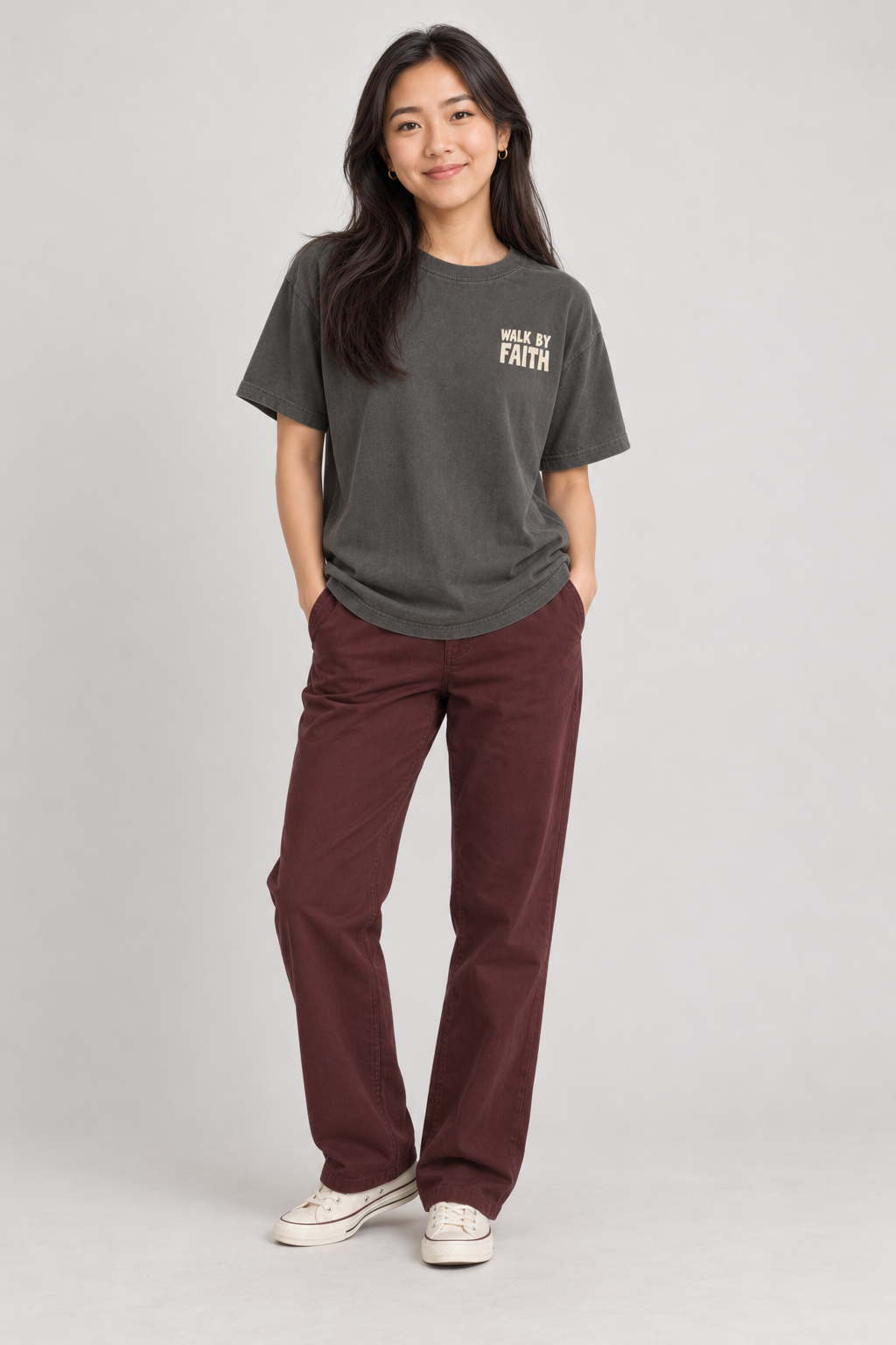 Woman wearing the Pepper Walk By Faith Tee in a standing pose.
