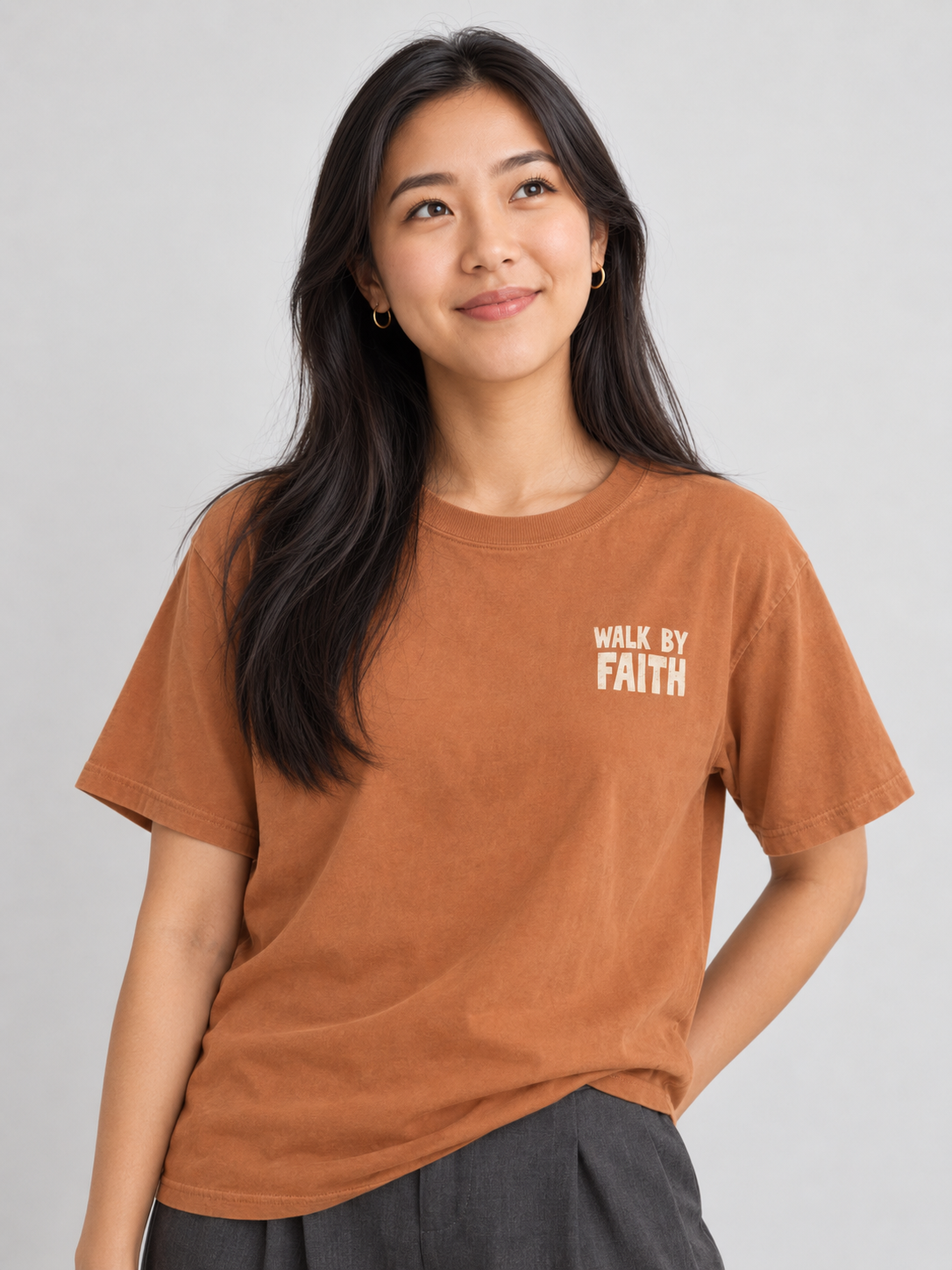 Woman wearing the Yam Walk By Faith Tee in a looking up pose.