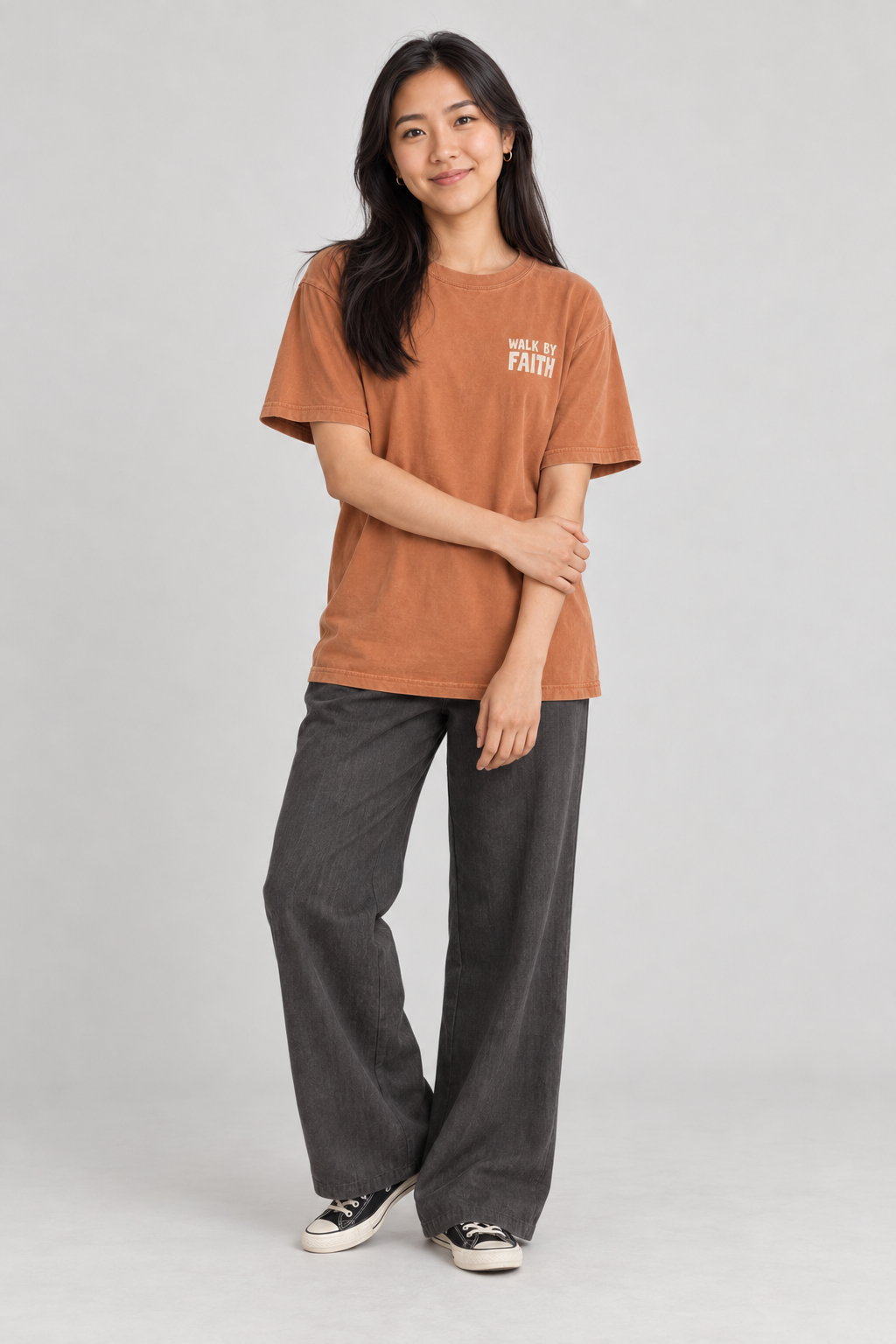 Woman wearing the Yam Walk By Faith Tee in a standing pose.